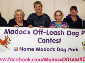 Madoc Off-leash Dog Park Association members Krista McConnell, Christine Hughes, Marianneke Bush, Emily Lederer, Lindsay Keller and Tanya Dawes proudly display their banner donated by Pet Pawsitive.