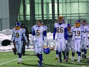 Bev Facey Falcons players can scarcely believe their season is over after suffering a 53-28 loss to the Spruce Grove Panthers in the Tier I provincial semifinal on Saturday night at Clarke Park in Edmonton. Photo by Ben Proulx/QMI Agency