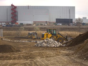 Construction machines move soil on the northern side of the CAMI assembly plant in Ingersoll. On Monday, Nov 19, 2012, dirt was being moved at the plant which assembles Chevrolet Equinox.