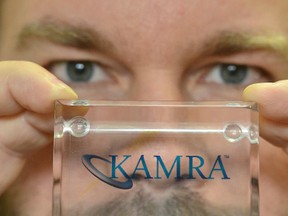 Dr. Richard Orr holds a plastic block containing a Kamra aperture inlay at his Grey Bruce Laser Vision Centre in Owen Sound. The inlay is implanted in the cornea to restore everyday near vision.