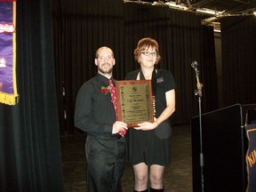 Moe Lacroix (left) is presented with a life membership in Kin Canada by District 3 (Saskatchewan) governor Sandi Barrie at a celebration held Saturday, November 17 in Melfort.