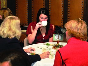 Reporter Megan Burke, centre, enjoys a cup of tea with tablemates during the annual Edwardian Tea held at Fulford Place.