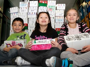 A group of Grade 2 students pose with their shoeboxes for Operation Christmas Child at Parkdale School in Wetaskiwin Nov. 13. Operation Christmas Child is a project of Samaritan’s Purse, and since 1993 has been sending shoeboxes full of gifts to children in more than 130 countries.