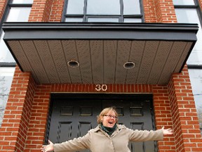 Vicky Smallood, Somerset West Community Health Centre board chair strikes a pose in front of the new location of the Hintonburg Hub at 30 Rosemount Ave Tuesday, Nov. 20, 2012. (QMI AGENCY/Darren Brown)