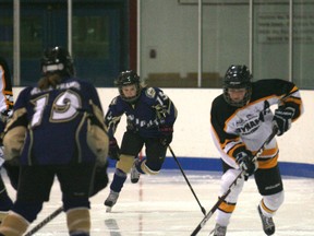 Alycia Robinson of the Fairview Dunvegan Dynamite Bantam Girls trying to get past the Grande Prairie Peewees at the Fairplex arena in Fairview on Saturday. Fairview won 4-0. (Simon Arseneau/Fairview Post)