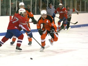 Brandon Bogdanek of the Fairview Flyers tries to get past Taylor Riddoch of the Slave Lake Wolves during NWJHL hockey action at the Fairplex arena on Sunday. It was the second of two home games in two days for the Flyers. (Simon Arseneau/Fairview Post)