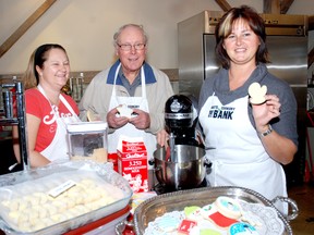 Vicky Sage, left, Keith Kelly, and Tsmmy Olivera show off the kind of cookies they will be baking at The Arts and Cookery Banjk Bake it Up event Saturday, Nov. 24 8 a.m. to 4 p.m.