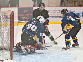 BRIAN THOMPSON, The Expositor

BCI goalie Braun Avarell watches the puck bounce off his blocker during a high school boys hockey game against St. John's on Tuesday at the civic centre.