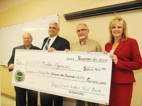 The Sudbury Food Bank presented cheques to their member agencies totalling over $222,000 on Tuesday afternoon. From left are board directors Joe Drago, Geoffrey Lougheed - Chair�, Bruce Cowan former Sudbury Star publisher, and Mellaney Dahl of Q92- Directors. GINO DONATO/THE SUDBURY STAR