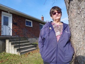 Brenda Turcotte Laberge outside her new home
