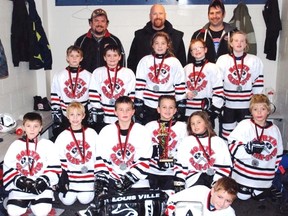 In front is Hayden Begin. Second row, from left, are Zache Gauthier, Devon Elliott, Logan MacMillan, Mason Mekker, Corinne Anderson and Noah Ault. Third row are Wyatt Amsing, Nicholas Rolland, Makayla Molinaro, Hamish Nowry and Dana Molinaro. Back row are head coach Todd Anderson, assistant coach/trainer Brian Nowry and assistant coach Steve Rolland.