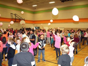 John Paul II students bounce balloons in the school gymnasium during Tuesday’s activities to kick off Bullying Awareness and Prevention Week in Ontario. The morning program featured a re-creation of the flash mob choreographed event performed to Katy Perry’s Firework in downtown Kenora, May 5. 
REG CLAYTON/Daily Miner and News