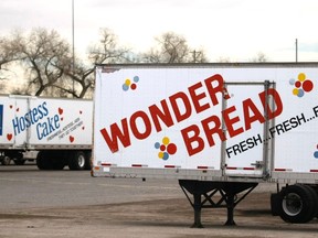 Trucks are parked at the closed Hostess plant in Denver November 19, 2012. (REUTERS/Rick Wilking)