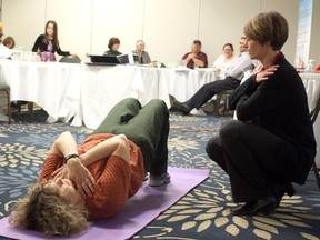 Timmins and District Hospital senior outpatient physiotherapist Sue Turcotte, right, and Diane Pigeau demonstrate the benefits of resistance exercises for people with diabetes. Other tips such as how to manage diet and relieve stress were discussed at an intimate presentation hosted by the VON Diabetes Education Centre at the Days Inn on Tuesday. The goal of the evening for the VON Centre was to help people with diabetes enjoy the holidays without giving up their favourite simple pleasures.