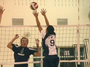 Chad McMonagle goes up for a hit during the St. Martin de Porres Kodiaks’ 25-15, 25-6, 25-17 victory over the Notre Dame Pride in the semifinals of the Calgary High School Division III senior boys’ volleyball playoffs. The Kodiaks went on to win the championship with a 19-25, 25-15, 25-22, 26-24 triumph over Bishop McNally.