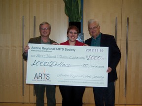 (From left) Stewart McLeish from Creative Airdrie, Kim Cheel from the Nose Creek Players and Ken Vick -ets from the Airdrie Regional Arts Society (ARTS) display a cheque for $1,000 that will go towards purchasing enhancements for the Bert Church Theatre Expansion.