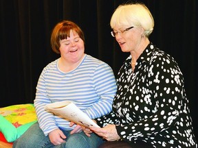 Student Laura Quesnelle practices a song with Katherine Porter, the executive director of the H'art Centre. (Whig-Standard file photo)