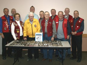 Members of the Airdrie Lions Club stand with some of the hundreds of donated eyeglasses for a Recycle for Sight program that is currently soliciting the collection of unused or unwanted eyeglasses. Most Airdrie optometry locations are participating and have recycle boxes (right).