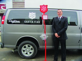 Lieutenant Peter Robinson of the Salvation Army in Portage la Prairie pictured with the Santa Van donated by Craig Dunn, Wednesday. The van helps the non-profit out during the holiday season with moving volunteers, Christmas kettles, and various donations and pick ups. (ROBIN DUDGEON/THE DAILY GRAPHIC/QMI AGENCY)