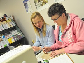 The North Bay Santa Fund opened its application office Tuesday at the Low Income People Involvement of Nipissing office on Main Street East. Volunteer Heather Kelso works alongside Lana Mitchell, LIPI's executive director and Santa Fund administrator, Wednesday. The office is accepting applications from 10 a.m. to 4 p.m. Monday to Friday. To download an application visit www.santafund.ca. (Brandi Cramer The Nugget)