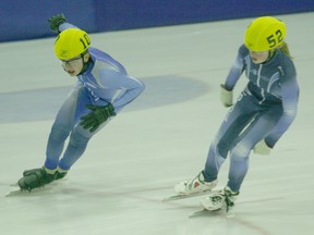 Northern Lites Speed Skating teammates Carson Kinshella (left) and Arianna Loogman (right) participate in the 1,500 metre event during the clubís ability meet at the Baytex Energy Centre on Saturday, Nov.17.