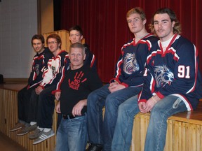 Former NHLer Chris Nilan, in centre wearing a No More Bullies T-shirt, is flanked by members of the Junior A Cornwall Colts at St. Joseph's Catholic Secondary School on Wednesday. Nilan gave the school’s students a rousing presentation on preventing bullying.
Tony Muma staff photo