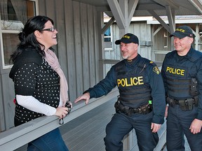 BRIAN THOMPSON, The Expositor

Carrie Arnold, manager of special events at Trillium Childhood Cancer Support Centre, chats with Norfolk OPP in-service training officers Sgt. Ron Turkiewicz (left), Const. Dave DeBruyne and Const. Dave Barnabi outside one of the camp's cabins on Wednesday. The officers made a donation from funds they had raised to the Waterford camp, which provides recreational experiences for children with cancer and their families.