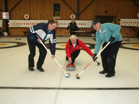 Elmer Fisher delivers a practice throw while sweepers Claude Charlebois, left, and Phil Curtis set their brooms in motion. The fourth member of their rink is Denny Delaurier who is seen watching from behind. The Fisher Rink from Iroquois Falls won the 19th-annual Dusty Baker Bonspiel which concluded Wednesday at the McIntyre Curling Club in Timmins. Twenty teams from across the region competed in the two-day seniors’ competition.