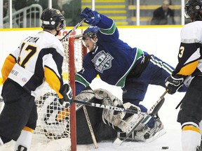 Sudbury Nickel Barons Marco Lizotte collides with Kirkland Lake Goldminers goalie Chris Komma during second period NOJHL action from the McClelland Arena on Wednesday night.
GINO DONATO/THE SUDBURY STAR