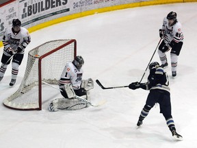 Ryan Baskerville one-times a pass from Sasha Larocque (behind net) past  Wolverines goalie Jared Rathjen for the game-winning goal with 1:28 to play. The Grande Prairie Storm extended their Alberta Junior Hockey League winning streak to 11 games with a 6-5 victory over the Whitecourt Wolverines on Wednesday