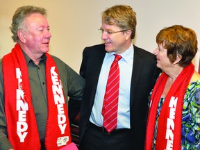 Gordon and Cheryl Hough wear their support for Gerard Kennedy, centre, at the Brockville Public Library Wednesday. Kennedy, a candidate for the Ontario Liberal leadership, paid a visit to speak with supporters and members of the Brockville Youth Advisory Committee (NICK GARDINER THE RECORDER AND TIMES).