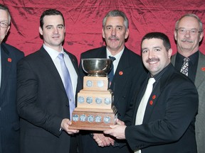 Winners of the 'A' Event at the 47th annunal DND Firefighters Bonspiel held last weekend at Trenton Curling Club were CFB Borden Fire #2, vice John Barker, lead Dave Bly, second Tom Hoday, skip Gilles Albert and presenter Maj Joel Chartrand, Commandant, CFB Borden Fire Academy.