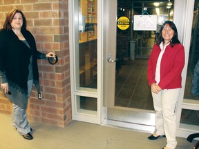 Unveiling a new automated door at the Petawawa Public Library are Kelly Thompson (left), children’s and young adult services manager and acting CEO, and Councillor Theresa Sabourin, chairwoman of the Petawawa Accessibility Committee and the council representative on the library board.