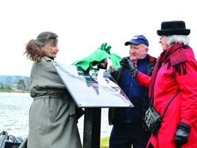 Marlene Savage, left, a Parcher descendant, Don McFadyen, an O’Brien descendant, and Mae Craig, a Brown descendant, officially unveil the Mayflower plaque at the wharf in Barry’s Bay.