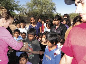 La Manga residents receive donations of clothes and food from Glen and Gail Fraser in January of 2012. Glen, who has been traveling to some of the poorest areas of Mexico to distribute donations for 30 years, will be making the trip yet again later this Christmas season.