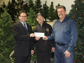 Gilles Belanger, Caisse Populaire, Nick Fasano, Director of the Abiti Eskimos and Claude Rocheleau, Manager of the Food Bank.