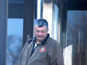 Sarnia fire chief Pat Cayen walks out of Sarnia court on Thursday, Nov. 22. He is facing 54 counts of sexual assault.