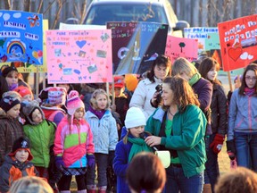 A rally held in Hearst Monday drew 400 people who want to keep Fushimi Lake Provincial Park open for camping. During the rally, eight-year-old Mai-Ann Dorval, with her mom Ricky-Ann holding the microphone, read a letter to the crowd which she wrote to Natural Resources Minister Michael Gravelle. In her letter, she explained why she loves the park and urged the government not to close it.
