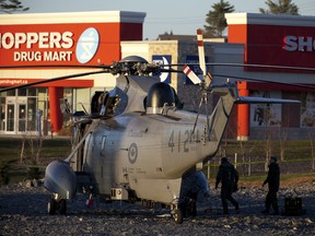 A Canadian Military Sea King Helicopter was forced to make an emergency in an empty lot in a residential area near a shopping centre in Halifax, N.S. Thursday, Nov. 22, 2012.  (Sándor Fizli/QMI Agency)