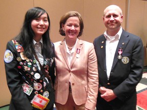 Grande Prairie’s Kevin Hilgers (right), District Governor for Rotary International District 5370, received the QEII Diamond Jubilee medal Wednesday from Premier Alison Redford. Rotary exchange student Ellie Huang of Taiwan was on hand. (Supplied)