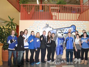 Some Keyano College Huskies athletes posed for a photo with Keyano president Kevin Nagel, Keyano athletic director Wade Kolmel and Keyano College mascot King at a news conference Thursday.  TREVOR HOWLETT/TODAY STAFF