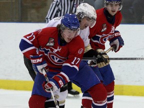 Kingston Voyageurs’ Brandon O’Quinn tries to control the puck against the Trenton Golden Hawks during Ontario Junior Hockey League action at the Invista Centre on Thursday night. Trenton won 5-1.
