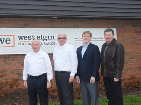Larry McLeod, left, chairman of the board of directors for West Elgin Mututal Insurance, Brian Downie, West Elgin Mutual Insurance president and CEO, Jeff Yurek, Progressive Conservative MPP, Elgin-Middlesex-London and Cameron McWilliam, mayor of Dutton-Dunwich, stand in front of a new sign for the company unveiled this week.