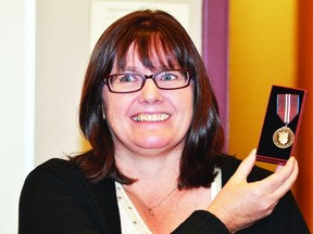 Boys and Girls Club of Wetaskiwin's executive director Dana Badke displays her Queen Elizabeth II Diamond Jubilee medal Nov. 23 at the club's facility.