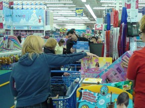 Shoppers line up at Toys R' Us on Merivale Rd. Friday, Nov. 23, 2012 to take advantage of the store's half price sale on Black Friday. They're one on several Ottawa retailers offering sales to compete with U.S. stores on Black Friday.
MIKE AUBRY/OTTAWA SUN/QMI AGENCY
