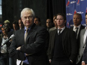Donald Fehr, executive director of the NHLPA, stands with NHLers during a press conference amid ongoing NHL labour talks. (STAN BEHAL, QMI Agency)
