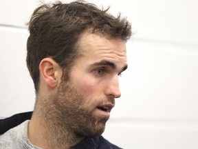 Jets forward Andrew Ladd speaks to media after a skate at the MTS Iceplex in Winnipeg, Man., Nov. 23, 2012. (JASON HALSTEAD/Winnipeg Sun)