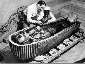 Howard Carter and an assistant are photographed with the King Tutankhamen sarcophagus at the opening of the tomb in February 1923.