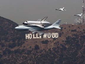 The space shuttle Endeavor flies by the Hollywood sign. Hollywood is one of the stops on the Sunshine Travel Club's best of California tour in 2013.