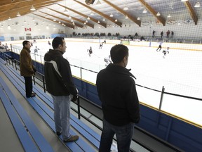 Spectators watch a "AA PeeWee" boys hockey game between the Stars and Twins at the Pioneer Arena in February 2012. The old arena is a far cry from the Scheels Arena in Fargo. (BRIAN DONOGH/Winnipeg Sun files)